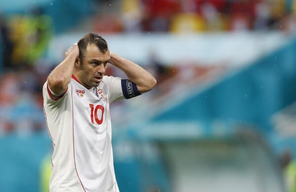 North Macedonia's Goran Pandev reacts after missing a chance to score during the Euro 2020 soccer championship group C match between Austria and Northern Macedonia at the National Arena stadium in Bucharest, Romania, Sunday, June 13, 2021. (AP Photo/Vadim Ghirda, Pool)
