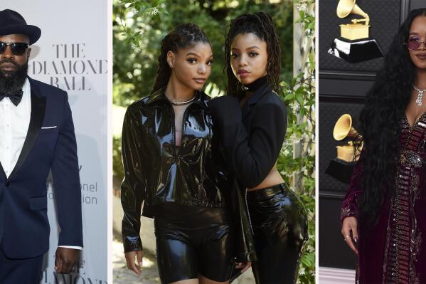 In this combination photo, Black Thought attends the 3rd Annual Diamond Ball on Sept. 14, 2017, in New York, from left, Halle Bailey and her sister Chloe Bailey, of Chloe X Halle, pose for a portrait in their backyard in Los Angeles on May 28, 2020, and H.E.R. arrives at the 63rd annual Grammy Awards on March 14, 2021, in Los Angeles. The artists and others have recorded songs honoring Juneteenth for Apple Music. Some artists recorded cover songs, while others composed new tracks for the exclusive "Juneteenth 2021 Freedom Songs" playlist, which launches Friday, June 4, 2021, on the streaming platform. (AP Photo)