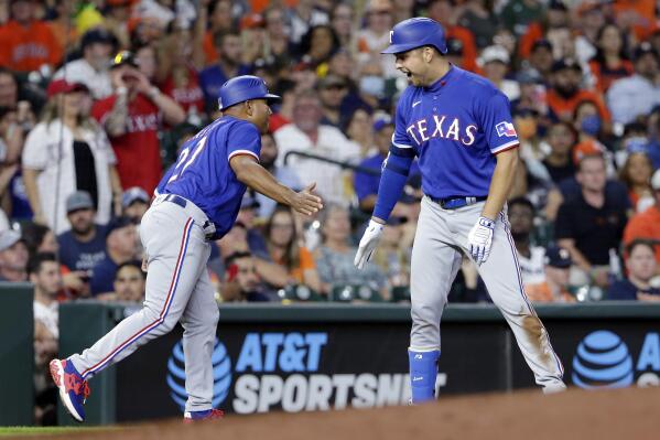 Texas Rangers' Nathaniel Lowe rounds the bases after hitting a two