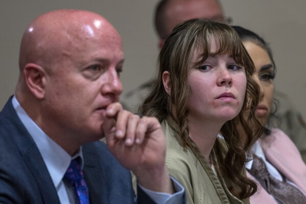 Hannah Gutierrez-Reed, center, sits with her attorney Jason Bowles and paralegal Carmella Sisneros during her sentencing hearing in Santa Fe, New Mexico, on Monday, April 15, 2024. Gutierrez-Reed, the armorer on the set of the Western film "Rust," was sentenced to 18 months in prison for involuntary manslaughter in the death of cinematographer Halyna Hutchins, who was fatally shot by Alec Baldwin in 2021. (Eddie Moore/The Albuquerque Journal via AP, Pool)