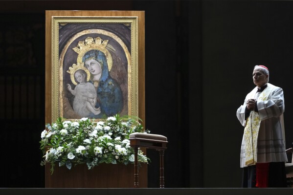 Cardinal Robert Francis Prevost, Prefect of the Dicastery for Bishops, leads the recitation of the Holy Rosary for Pope Francis' health in St Peter's Square at the Vatican, March 3, 2025. (AP Photo/Kirsty Wigglesworth, File)