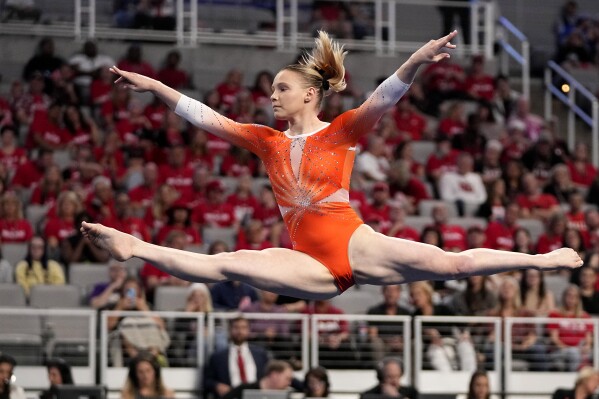 Oregon State's Jade Carey competes in the floor exercise during the NCAA women's gymnastics championships in Fort Worth, Texas, Thursday, April 18, 2024. (AP Photo/Tony Gutierrez)