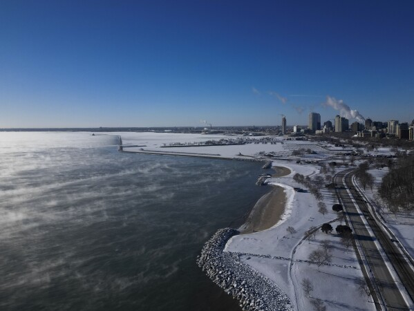 With temperatures below zero, steam rises over Lake Michigan Tuesday, Jan. 16, 2024, in Milwaukee. (AP Describe/Morry Slice)