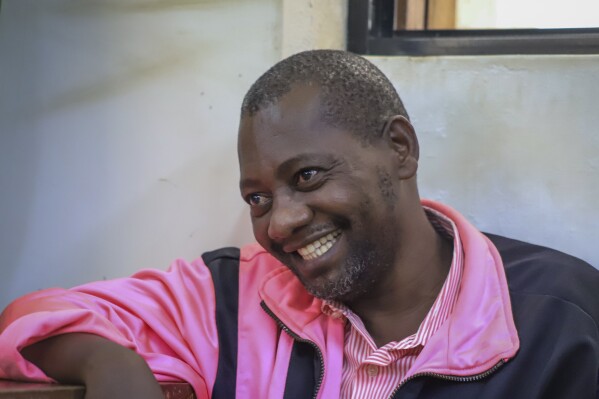 FILE - Preacher Paul Mackenzie, who was arrested for asking his followers to starve to death in order to meet Jesus, appears at a court in Malindi, Kenya on May 2, 2023. A Kenyan magistrate Tuesday, Feb. 20, 2024, ordered the main suspect in a doomsday starvation cult and 94 of his followers to receive emergency care after some of the suspects had to be carried into the courtroom to answer manslaughter charges, too frail and weak to 