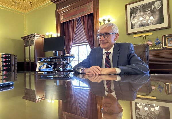 Wisconsin Gov. Tony Evers speaks with The Associated Press in his state Capitol office in Madison, Wis. office Wednesday, Jan. 3, 2024, about what President Joe Biden must do to win the battleground state in November. (AP Photo/Todd Richmond)