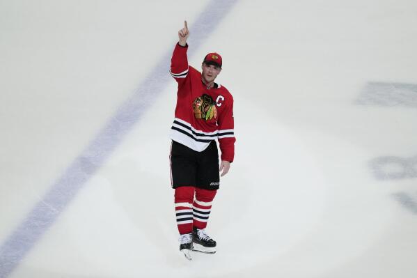 Chicago Blackhawks center Jonathan Toews waves to the crowd after the Flyers defeated the Chicago Blackhawks 5-4 in overtime in Toews' final NHL hockey game with the Blackhawks, Thursday, April 13, 2023, in Chicago. (AP Photo/Nam Y. Huh)
