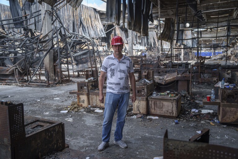 Store manager Oleksandr Lutsenko stands inside of Epicenter shopping complex in Kharkiv, Ukraine, Thursday, June 6, 2024. The bombing of the Epicenter with glide bombs by the Russian military in May killed 19 people, including two children. In all, glide bombs have hit the city more than 50 times in 2024, according to Spartak Borysenko of the Kharkiv regional prosecutor's office. (AP Photo/Evgeniy Maloletka)
