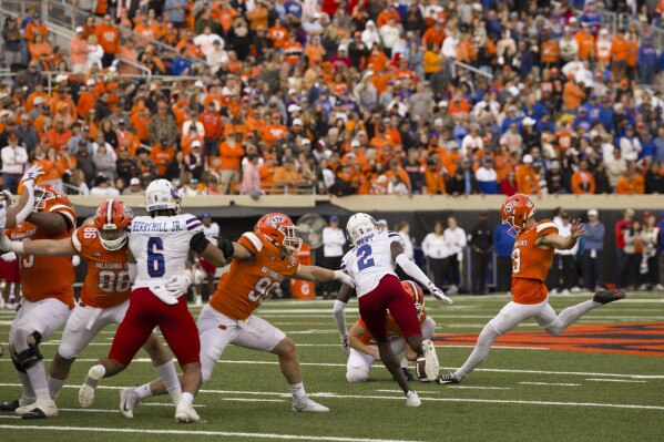 Oklahoma State's Alex Hale (19) kicks a field goal at the end the second half of an NCAA college football game against Kansas in Stillwater, Okla., Saturday, Oct. 14, 2023. (AP Photo/Mitch Alcala)