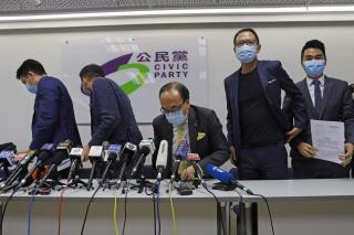 FILE - From right, pro-democracy Civic Party members, Cheng Tat-hung, Dennis Kwok, Alan Leong, Alvin Yeung and Jeremy Tam leave a news conference after being disqualified for a legislative election in Hong Kong, July 30, 2020. Hong Kong pro-democracy political party Civic Party on Saturday, May 27, 2023 voted to dissolve, after none of its members filed nominations to take up executive committee positions. (AP Photo/Kin Cheung, File)