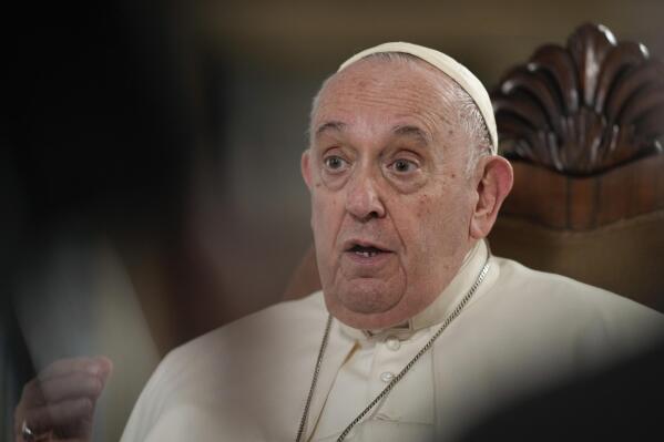 Pope Francis speaks during an interview with The Associated Press at The Vatican, Tuesday, Jan. 24, 2023. According to the pope, the arms industry has brought untold death and destruction to the world. “The world is obsessed with weapons,” he said. (AP Photo/Andrew Medichini)