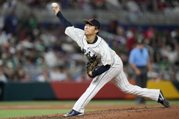 FILE - Japan's Yoshinobu Yamamoto delivers a pitch during the fifth inning of a World Baseball Classic game against Mexico on March 20, 2023, in Miami. Yamamoto, the most prized pitcher on the free-agent market, has agreed to a $325 million, 12-year contract with the Los Angeles Dodgers, according to multiple reports. (AP Photo/Wilfredo Lee, File)