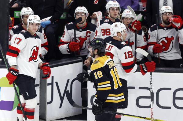 Bruins beat Devils 2-1, match NHL record with 62nd win