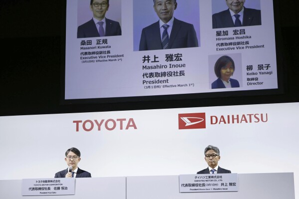 Masahiro Inoue, right, now overseeing Toyota’s business in South America, and Toyota Chief Executive Koji Sato attend a press conference in Tokyo Tuesday, Feb. 13, 2024. Japanese automaker Daihatsu on Tuesday named a veteran at its parent company Toyota to replace its president as it tries to repair the damage from a scandal over cheating on vehicle safety tests. Inoue will become Daihatsu President effective in March. (Kyodo News via AP)