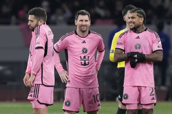 Inter Miami's Lionel Messi, center, reacts with teammates during a penalty shootout at the friendly soccer match between Vissel Kobe and Inter Miami CF at the National Stadium, Wednesday, Feb. 7, 2024, in Tokyo, Japan. (AP Photo/Eugene Hoshiko)