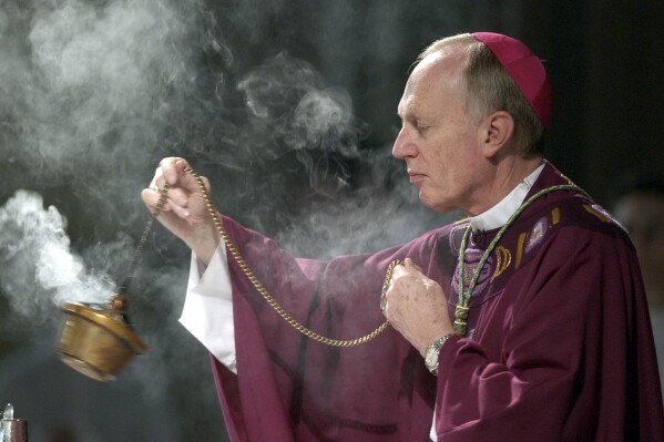 FILE - Bishop Howard Hubbard swings incense during an Ash Wednesday communion service at the Cathedral of the Immaculate Conception on Feb. 25, 2004, in Albany, N.Y. The 84-year-old retired bishop of Albany, who has been accused of sexual abuse and has unsuccessfully sought to be removed from the priesthood, said Tuesday, Aug. 1, 2024, he recently married a woman in a civil ceremony. (AP Photo/Jim McKnight, File)