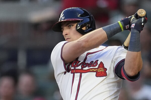 Atlanta Braves' Austin Riley follows through on a base hit in the third inning of a baseball game against the Boston Red Sox Tuesday, May 7, 2024, in Atlanta. (AP Photo/John Bazemore)