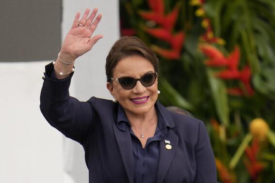 FILE - Honduras' President Xiomara Castro waves during the swearing-in ceremony for Colombia's President Gustavo Petro in Bogota, Colombia, Sunday, Aug. 7, 2022. Honduras became the second country in Central America to impose a state of exception suspending some constitutional rights to help fight street gangs when a decree took effect Monday, Dec. 5, 2022. (AP Photo/Fernando Vergara, File)