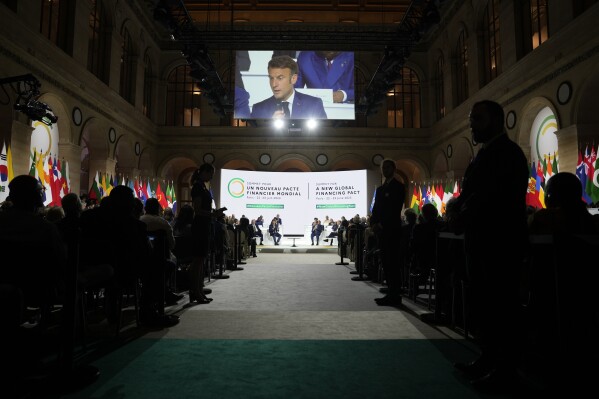 French President Emmanuel Macron speaks during the closing session of the New Global Financial Pact Summit, Friday, June 23, 2023 in Paris. The aim of the two-day climate and finance summit was to set up concrete measures to help poor and developing countries whose predicaments have been worsened by the devastating effects of the COVID-19 pandemic and the war in Ukraine better tackle poverty and climate change. (AP Photo/Lewis Joly, Pool)