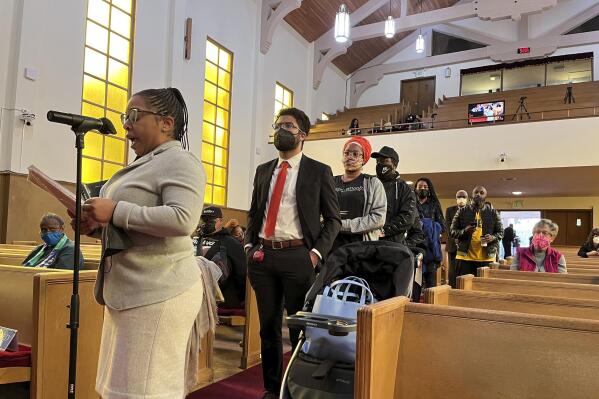FILE - People line up to speak during a reparations task force meeting at Third Baptist Church in San Francisco on April 13, 2022.  A report by California's first in the nation task force on reparations Wednesday, June 1 will document in detail the harms perpetuated by the state against Black people and recommend ways to address those wrongs. (AP Photo/Janie Har, File)