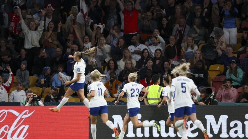 England's Georgia Stanway, left, celebrates after scoring the opening goal during the Women's World Cup Group D soccer match between England and Haiti in Brisbane, Australia, Saturday, July 22, 2023. (AP Photo/Tertius Pickard)