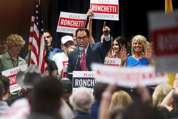 Republican Mark Ronchetti addresses the crowd with his wife and two daughters after winning the Republican primary for governor of New Mexico, during an election party in northeast Albuquerque, N.M., Tuesday, June 7, 2022. Ronchetti will be running against Democratic Gov. Michelle Lujan Grisham.  (Chancey Bush/The Albuquerque Journal via AP)