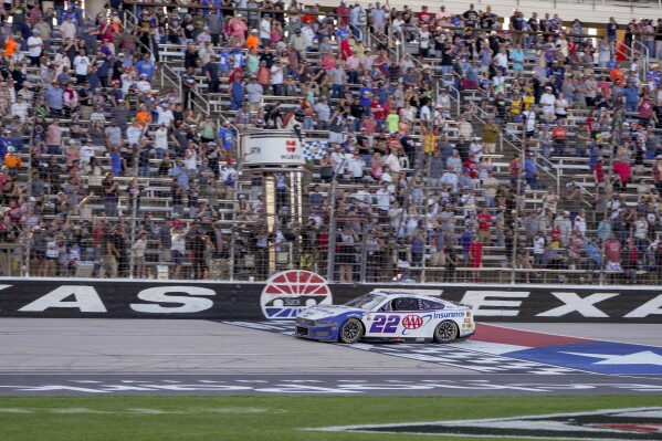 Joey Logano crosses the finish line to win a NASCAR Cup Series auto race at Texas Motor Speedway in Fort Worth, Texas, Sunday, May 4, 2025. (AP Photo/Larry Papke)
