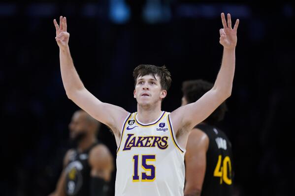 Los Angeles Lakers' Austin Reaves celebrates his three-point basket during the second half of an NBA basketball game against the Golden State Warriors Sunday, March 5, 2023, in Los Angeles. (AP Photo/Jae C. Hong)