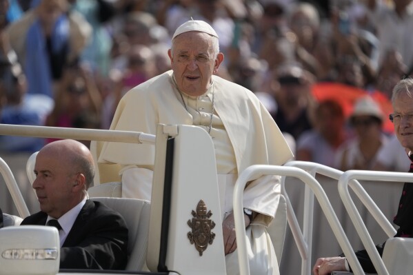 FILE - Pope Francis arrives in St. Peter's Square for his weekly general audience Wednesday, June 28, 2023. The Vatican says Pope Francis will make a two-day trip to Marseille, France, in late September. The announcement on Saturday, July 29, 2023 adds more travel to a flurry of trips the 86-year-old pontiff will be making in the coming weeks. (AP Photo/Andrew Medichini, File)