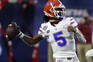 FILE - In this Dec. 30, 2020, file photo, Florida quarterback Emory Jones (5) throws a pass in the first half of the Cotton Bowl NCAA college football game against Oklahoma in Arlington, Texas. Jones first landed on Dan Mullen’s recruiting radar seven years ago. Jones was a high school freshman in LaGrange, Ga., and Mullen was scouring the country for another spread quarterback at Mississippi State. They bonded quickly, and when Mullen took over in Gainesville three years later, he asked Jones to join him. (AP Photo/Ron Jenkins, File)