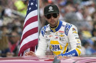 FILE -Chase Elliott during driver introductions before the NASCAR Daytona 500 auto race at Daytona International Speedway, Sunday, Feb. 19, 2023, in Daytona Beach, Fla. Chase Elliott will return to the No. 9 Chevrolet Camaro ZL1 in the April 16, 2023 NASCAR Cup Series race at Martinsville Speedway after recovering from a leg injury.(AP Photo/John Raoux, File)