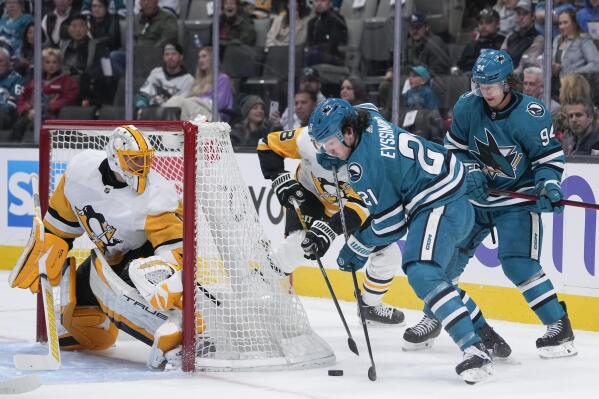 San Jose Sharks center Michael Eyssimont (21) prepares to shoot against Pittsburgh Penguins goaltender Casey DeSmith, left, during the first period of an NHL hockey game in San Jose, Calif., Tuesday, Feb. 14, 2023. (AP Photo/Godofredo A. Vásquez)