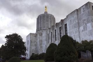 FILE - The Oregon state Capitol is seen in Salem, Ore., on Jan. 11, 2018. Oregon's state House has approved a wide-ranging bill that would expand access to abortion and gender-affirming health care for transgender people. The bill passed along party lines Monday night, May 1, 2023, with Democrats voting in favor and Republicans against. (AP Photo/Andrew Selsky, File)