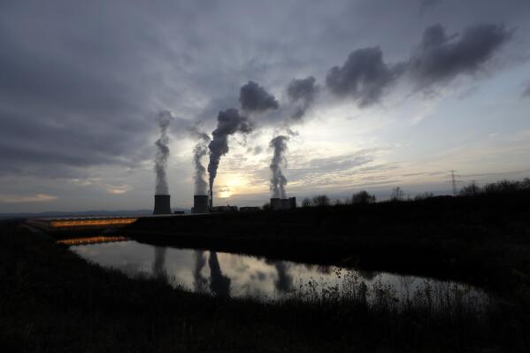 FILE - smoke rises from chimneys of the Turow power plant located by the Turow lignite coal mine near the town of Bogatynia, Poland, on Nov. 19, 2019. A scheme to develop small nuclear power reactors in Poland is moving forward, with a co-operation agreement between the Polish energy giant ORLEN and two U.S. government financial institutions. Poland, which has traditionally relied heavily on its own coal and Russian energy imports, is seeking a shift toward renewable and non-carbon energy. (AP Photo/Petr David Josek, File)