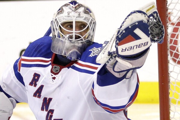 FILE - New York Rangers goalie Henrik Lundqvist, of Sweden, gloves the puck while playing against the Los Angeles Kings during the second period in Game 5 of the NHL Stanley Cup Final series in Los Angeles, June 13, 2014. Henrik Lundqvist is expected to be elected to the Hockey Hall of Fame in his first year of eligibility. (AP Photo/Jae C. Hong, File)