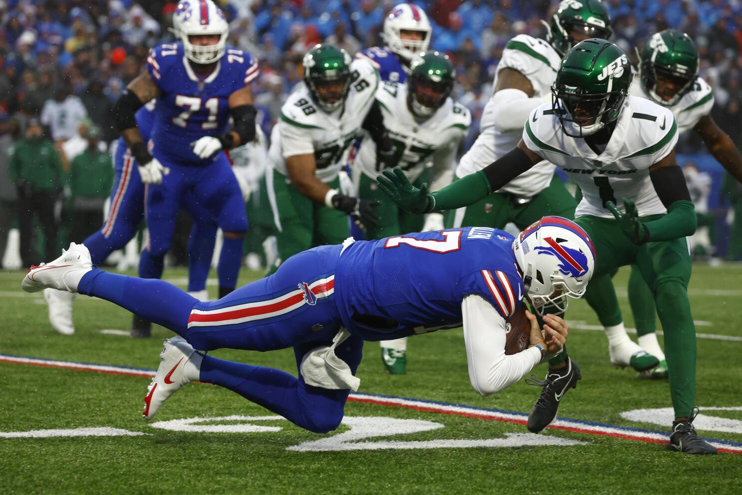 AFC-leading Bills overcome elements, beat White, Jets 20-12