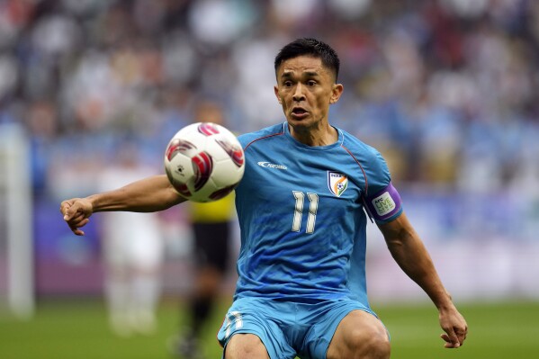 FILE - India's Sunil Chhetri controls the ball during the Asian Cup Group B soccer match between Syria and India at Al Bayt Stadium in Al Khor, Qatar, Jan. 23, 2024. Chhetri said this week that after 150 games for India, June’s World Cup qualifier against Kuwait in Kolkata will be his last before retiring. (AP Photo/Aijaz Rahi, File)