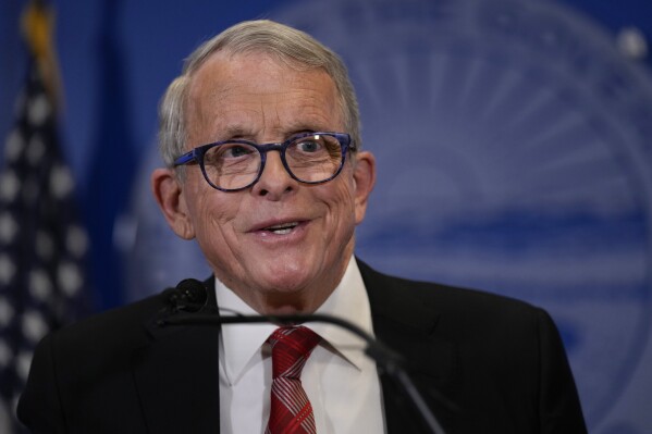 FILE - Ohio Gov. Mike DeWine speaks during a news conference, Dec. 29, 2023, in Columbus, Ohio. DeWine parted ways with Donald Trump on Monday, March 11, 2024, and endorsed state Sen. Matt Dolan over Trump-backed businessman Bernie Moreno in the state's three-way GOP primary for a U.S. Senate seat. (AP Photo/Carolyn Kaster, File)