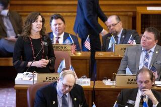 FILE - In this Monday, March 29, 2021, file photo, Rep. Taffy Howard, left, R-Rapid City speaks in opposition to Gov. Kristi Noem's edits of House Bill 1217 at the South Dakota state capitol building during the legislative session in Pierre, S.D. South Dakota state Rep. Howard formally announced Tuesday, Oct. 12, that she is challenging Dusty Johnson, the state's lone U.S. congressman, in next year's Republican primary. (Grace Pritchett/Rapid City Journal via AP, File)