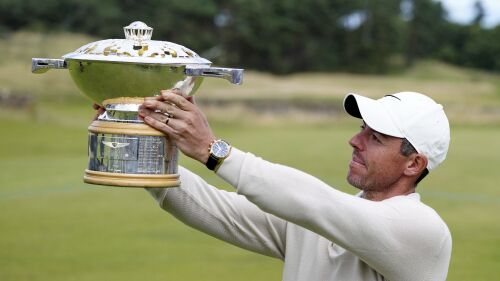 Northern Ireland's Rory McIlroy lifts the trophy following day four of the Genesis Scottish Open 2023 golf tournament at The Renaissance Club, North Berwick, Britain, Sunday, July 16, 2023. (Jane Barlow/PA via AP)