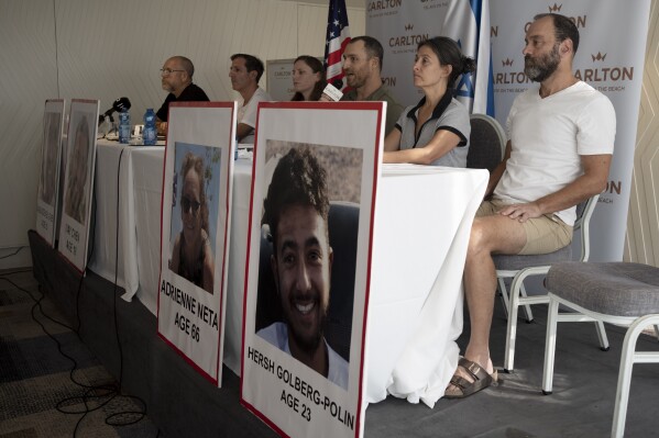 FILE - Rachel Goldberg, second right, mother of Hersh Goldberg-Polin, 23, and Jonathan Polin, Hersh's father, right, take part in a press conference with relatives of U.S. citizens that are missing since a cross-border attack by Hamas militants near the Gaza border, on Oct. 10, 2023 in Tel Aviv, Israel. (AP Photo/Maya Alleruzzo, File)