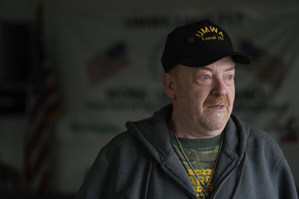 Frank "Rusty" Brown poses for a picture at the union office, across the street from the Remington Arms Co. compound, in Ilion, N.Y., Thursday, Feb. 1, 2024. (AP Photo/Seth Wenig)