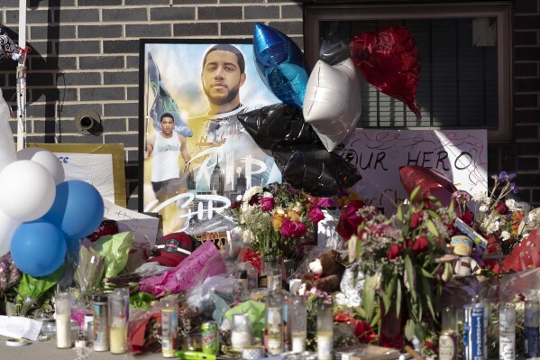 FILE - Items fill a makeshift memorial for Temple University Police Officer Christopher Fitzgerald, Feb. 23, 2023, in Philadelphia. On Tuesday, Jan. 23, 2024, Miles Pfeffer of suburban Philadelphia waived his right to a preliminary hearing and is headed to trial on charges including murder and murder of a law enforcement officer in the Feb. 19, 2023, slaying of 31-year-old Fitzgerald. (AP Photo/Matt Rourke, File)