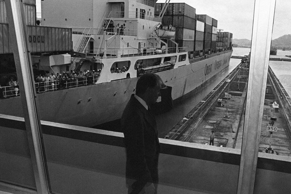 President Jimmy Carter views the Panama Canal at the Miraflores Locks in Canal Zone on June 17, 1978. On Friday Carter signed the final Panama Canal Treaties giving control of the canal to Panama in 2000. (AP Photo/Tasnadi, File)