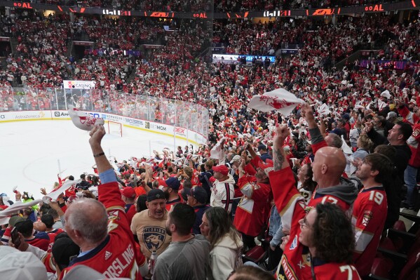 Florida Panthers fans wave towels during the third period in Game 3 of the NHL hockey Stanley Cup Eastern Conference finals against the Carolina Hurricanes Saturday, May 24, 2025, in Sunrise, Fla. (AP Photo/Lynne Sladky, File)
