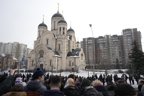 People gather outside the Church of the Icon of the Mother of God Soothe My Sorrows, in Moscow, Russia, Friday, March 1, 2024. Relatives and supporters of Alexei Navalny are bidding farewell to the opposition leader at a funeral in southeastern Moscow, following a battle with authorities over the release of his body after his still-unexplained death in an Arctic penal colony. (AP Photo)