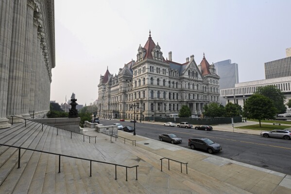 FILE - The New York state Capitol is seen from the steps of the State Education Building in Albany, N.Y., Wednesday, June 7, 2023. A New York judge on Tuesday, May 7, 2024, blocked a politically important abortion rights amendment from appearing before voters on the November ballot. State Supreme Court Justice Daniel J. Doyle found that state lawmakers failed to follow procedural rules around passing constitutional amendments, incorrectly approving the amendment before getting a written opinion on the language from the attorney general. (AP Photo/Hans Pennink, File)