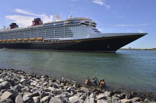 The Disney Dream sails out of Port Canaveral, Fla. on a two night test sailing, also known as a simulation cruise, Saturday, July 17, 2021. The cruise included about 300 Disney cruise employees and their guests. This is the first cruise activity out of Port Canaveral since March of 2020 when cruising was shut down due to COVID-19. (Malcolm Denemark/Florida Today via AP)