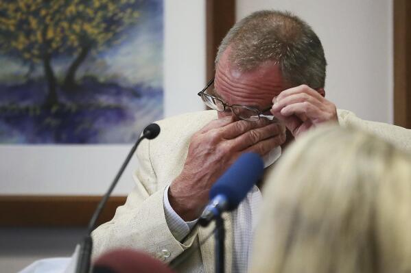 Neil Heslin, father of 6-year-old Sandy Hook shooting victim Jesse Lewis, becomes emotional during his testimony during the trial for Alex Jones, Tuesday Aug. 2, 2022, at the Travis County Courthouse in Austin.  Jones has been found to have defamed the parents of a Sandy Hook student for calling the attack a hoax. (Briana Sanchez/Austin American-Statesman via AP, Pool)
