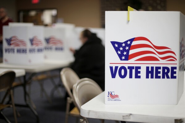 FILE - A woman votes in the presidential primary election in Kansas City, Mo., on March 10, 2020. Missouri Democrats and unaffiliated voters will participate Saturday, March 23, 2024, in the state's first party-run presidential primary since Republican lawmakers canceled the state-run presidential primary in 2022. (AP Photo/Charlie Riedel, File)