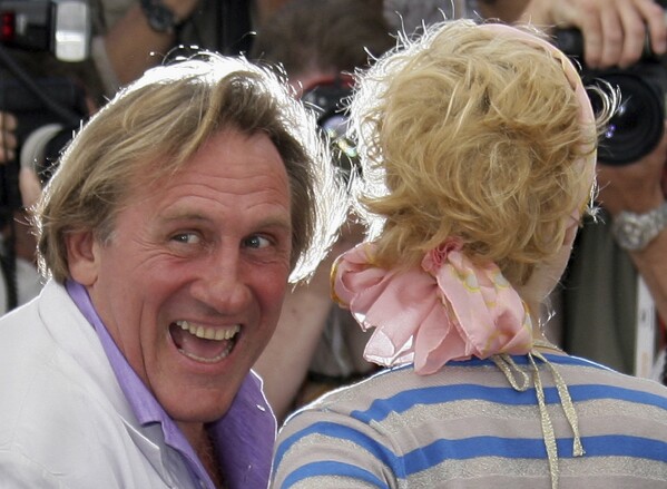 French actor Gerard Depardieu, left, and Belgian actress Cecile de France pose during a photo call for the film 